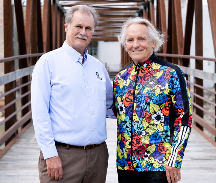 Chip Hart and Mike Rorabeck standing on a bridge